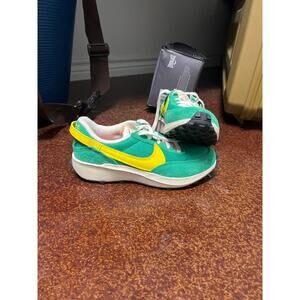 Green and yellow waffle bottom nikes